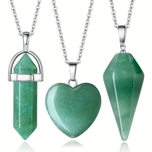 Detail of green aventurine stone pendant set with hexagonal pillar and heart shapes