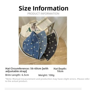 Detailed view of daisy embroidery on denim bucket hats with size and weight specifications