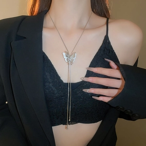 Detail of silver double butterfly necklace with tassel pendant and adjustable Y-chain