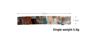 Detail of tortoise shell acetate hair clip with dimensions 7.5cm by 1.1cm on white background