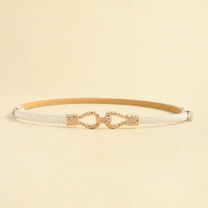 Detailed close-up of white leather belt featuring a golden interlocking twisted buckle