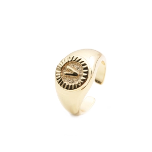 Macro view of gold-plated letter V ring featuring an adjustable open band design