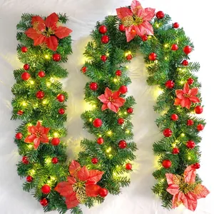 2.7m Christmas garland with red poinsettias, ornaments and warm LED lights for decor