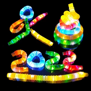 Colorful LED pop tubes toys creatively arranged into a human shape and 2022 number