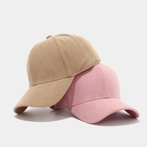 Classic corduroy baseball caps in khaki and pink colors with vintage textured fabric