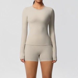 Front view of beige high-elasticity sports set with long sleeve top and cycling shorts
