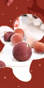 Close-up of velvet flocked Christmas balls with star patterns and gold hanging loops