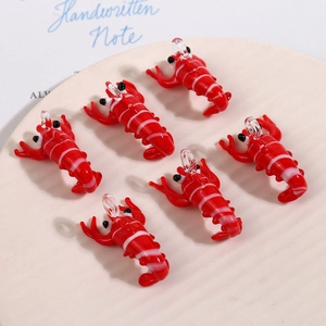 Handmade glass lobster pendants with red and white stripes for creative DIY jewelry making