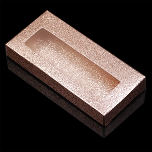 Macro shot of rose gold glitter eyelash box with transparent window and glossy finish