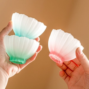 Exquisite lotus-shaped gradient frosted glass tea cups set in pink and green hues