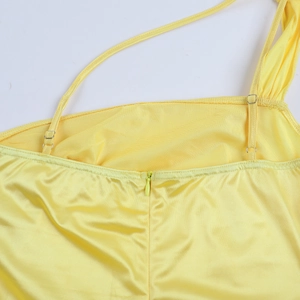 Detail of yellow satin dress showing invisible zipper and adjustable metal buckle strap