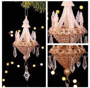 Detailed view of acrylic star ornament with glitter on a Christmas tree with bokeh light