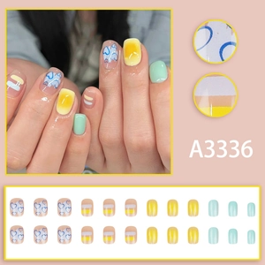 Colorful mix of heart pattern and pastel stripe press-on nails for summer vibes