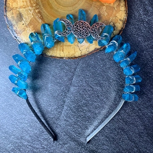 Detail of bohemian sky blue crystal crown featuring moon pendants and silver wire wrap