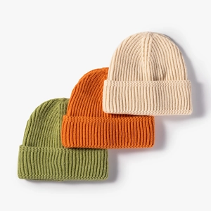 Thick ribbed knit beanie hats in green, orange and beige for autumn and winter warmth