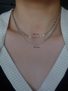 Macro shot of double layered silver titanium steel necklaces in 40cm and 45cm lengths