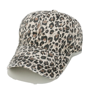 Detail shot of distressed leopard print baseball cap featuring vintage frayed edge texture