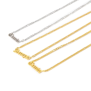 Detailed shot of 18K gold and silver plated Gemini and Sagittarius zodiac necklaces