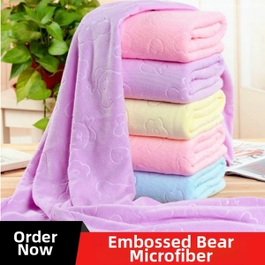 Soft microfiber bath towels featuring embossed bear patterns in assorted pastel colors