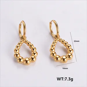 Detail view of 22x16mm golden teardrop beaded earrings in 304 stainless steel