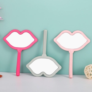 Lip-shaped handheld makeup mirrors in rose red, light gray, and soft pink colors