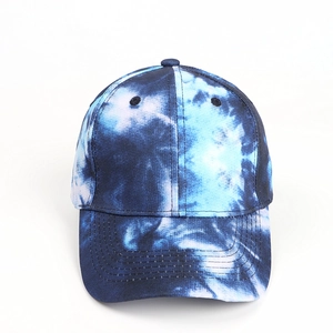 Detailed close-up of blue and white tie-dye patterns on a six-panel baseball cap