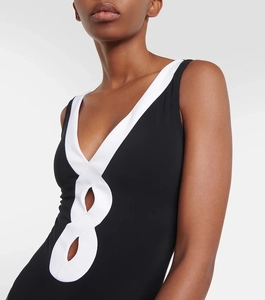 Detail of V-neck one-piece swimsuit featuring black and white contrast wavy piping design