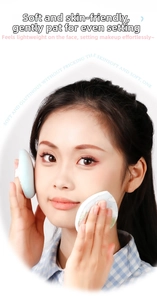 Close-up of soft blue velvet makeup puff used by a model for professional face setting