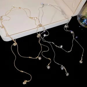 Colliers minimalistes dorés et argentés avec pendentifs en zircon et chaînes étagées
