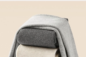 Close-up of stacked vertical striped cotton leggings in gray and beige tones