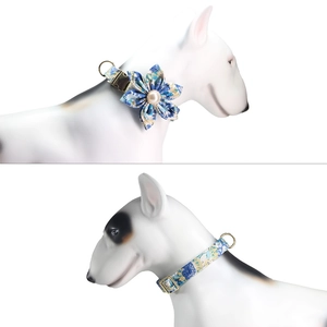 Detailed blue floral pet collar with handmade flower and gold metal buckle on a dog