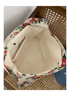Internal view of the floral canvas tote bag showing large capacity and magnetic buckle