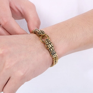 Close-up of vintage double snake head bracelet in 18K gold plated stainless steel