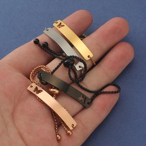 Detail of adjustable bar bracelets with cutout butterfly in gold, silver, rose gold and black