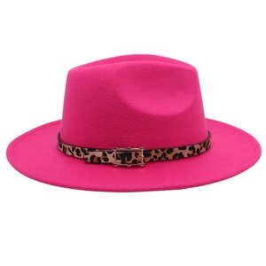 Detail of rose red fedora hat featuring leopard print belt and golden buckle