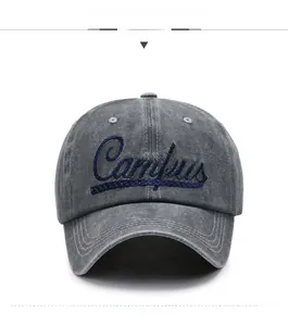 Detailed front view of washed grey baseball cap with blue Campus embroidery