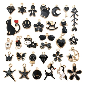 Variety of black enamel DIY metal charms in animal and heart shapes with gold plating