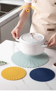 Detailed view of flower shaped silicone heat resistant mats with non-slip texture