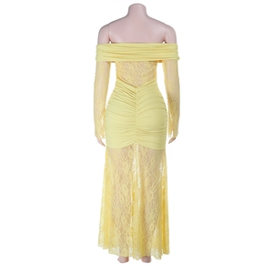 Detail of yellow off-shoulder lace dress showing back ruched design and slim fit cut