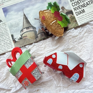 Detailansicht der glitzernden Weihnachts-Haarklammern Set mit Glocke und Geschenkbox