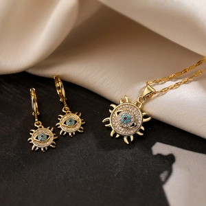 Set di gioielli placcati in oro 18 carati con ciondoli occhio del sole e turchesi