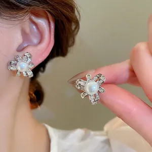 Elegant silver pearl bow earrings with zircon flower design for a vintage luxury jewelry look