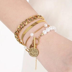 Gold layered bracelet set featuring Cuban link chains, pearls, and coin T-bar pendant