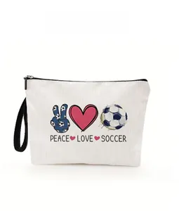 Detailed close-up of white canvas soccer makeup bag with Peace Love Soccer print