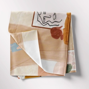 Detail of bohemian tapestry featuring minimalist profile lines and abstract geometric patterns