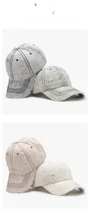 Detail view of four distressed washed baseball caps with vintage frayed holes and top stitching