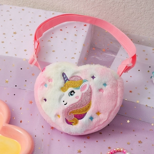 Detail of plush heart-shaped crossbody bag featuring unicorn embroidery and adjustable strap