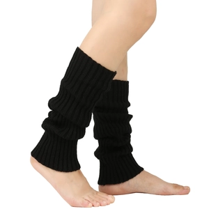 Detail of black knit leg warmers showing thick vertical ribbed texture and slouchy style