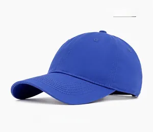 Detailed close-up of navy blue cotton baseball cap stitching and six-panel crown structure