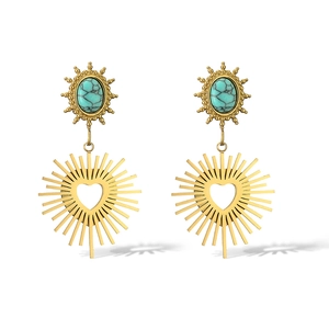 Vintage gold turquoise earrings featuring sunburst drop with heart-shaped cutout detail